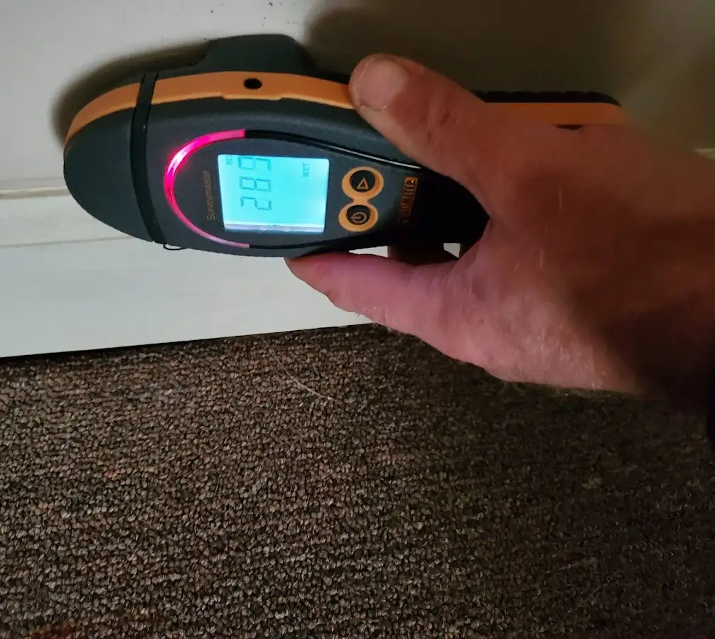 Moisture detection at baseboard during Storm Damage Restoration in Cudahy